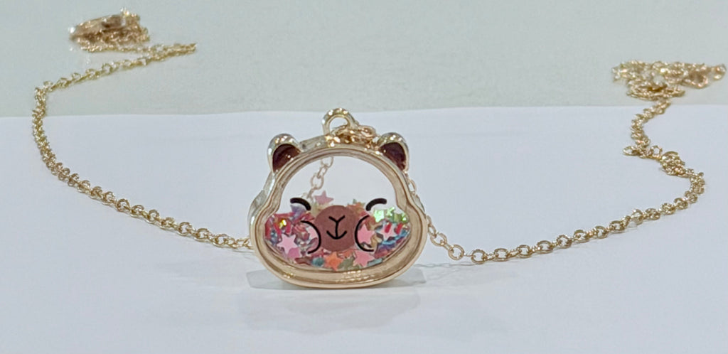 Necklace with a capybara-shaped pendant on a white background