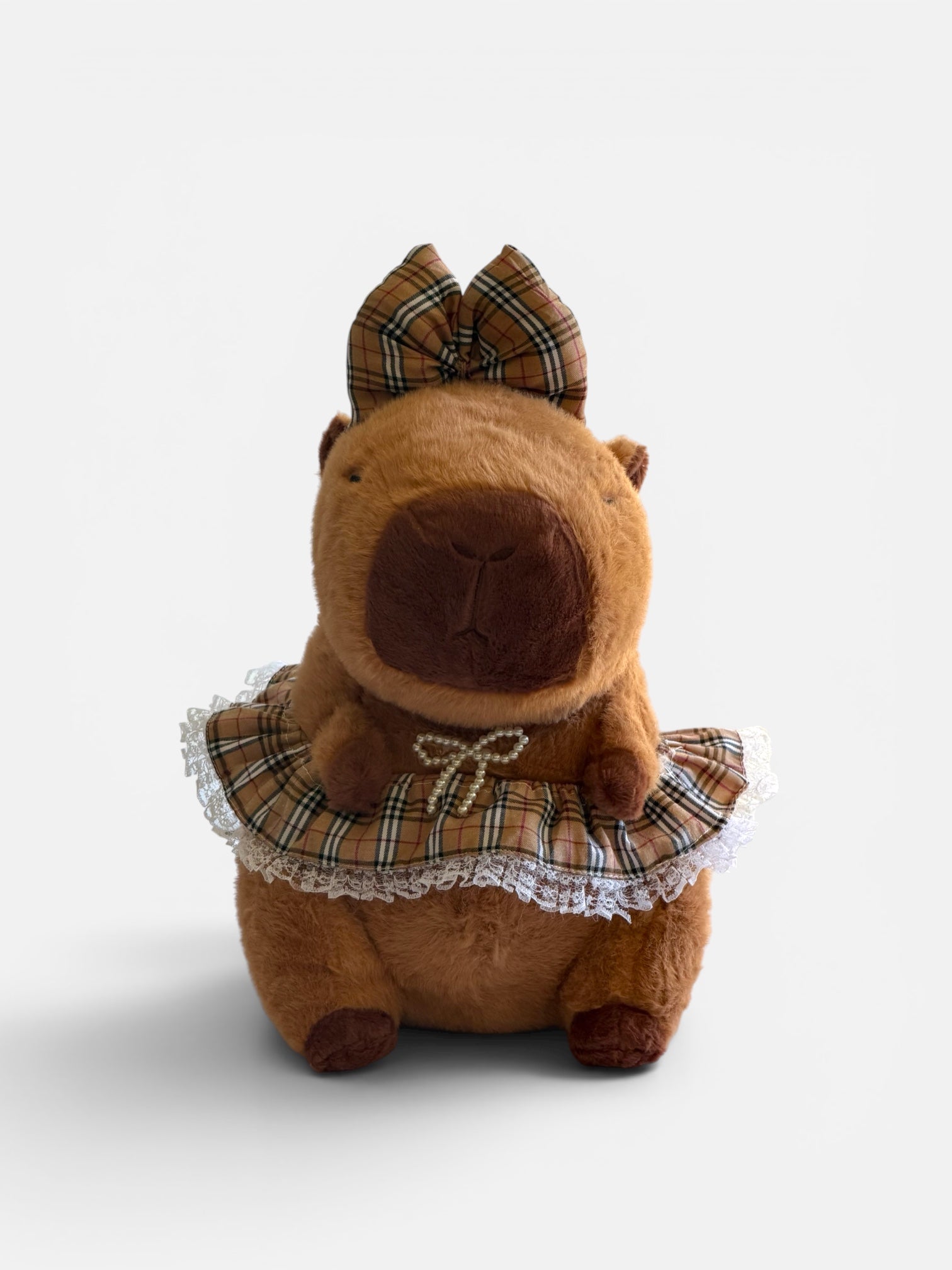 Capybara plush toy with plaid bow and skirt 