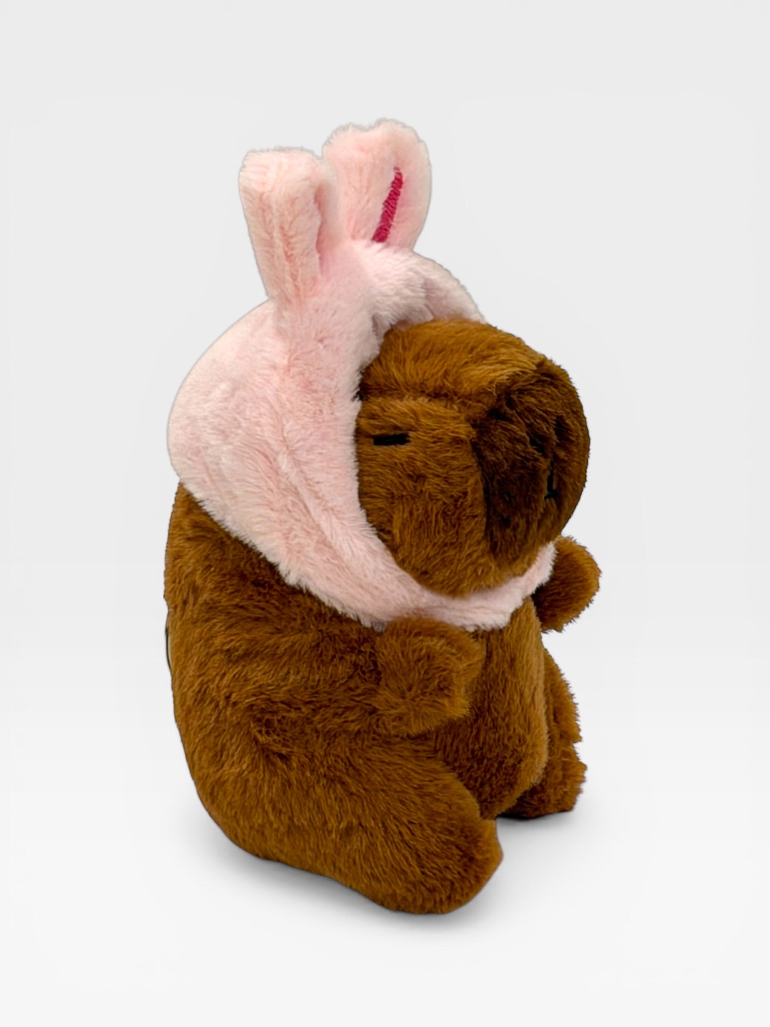 Capybara plush toy with pink bunny ears 