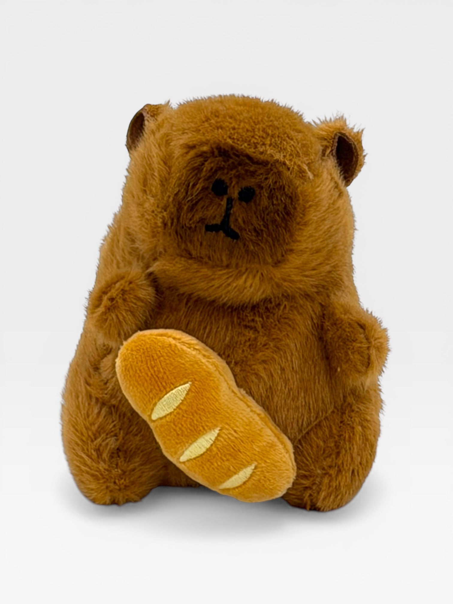Plush Capybara holding a loaf of bread 