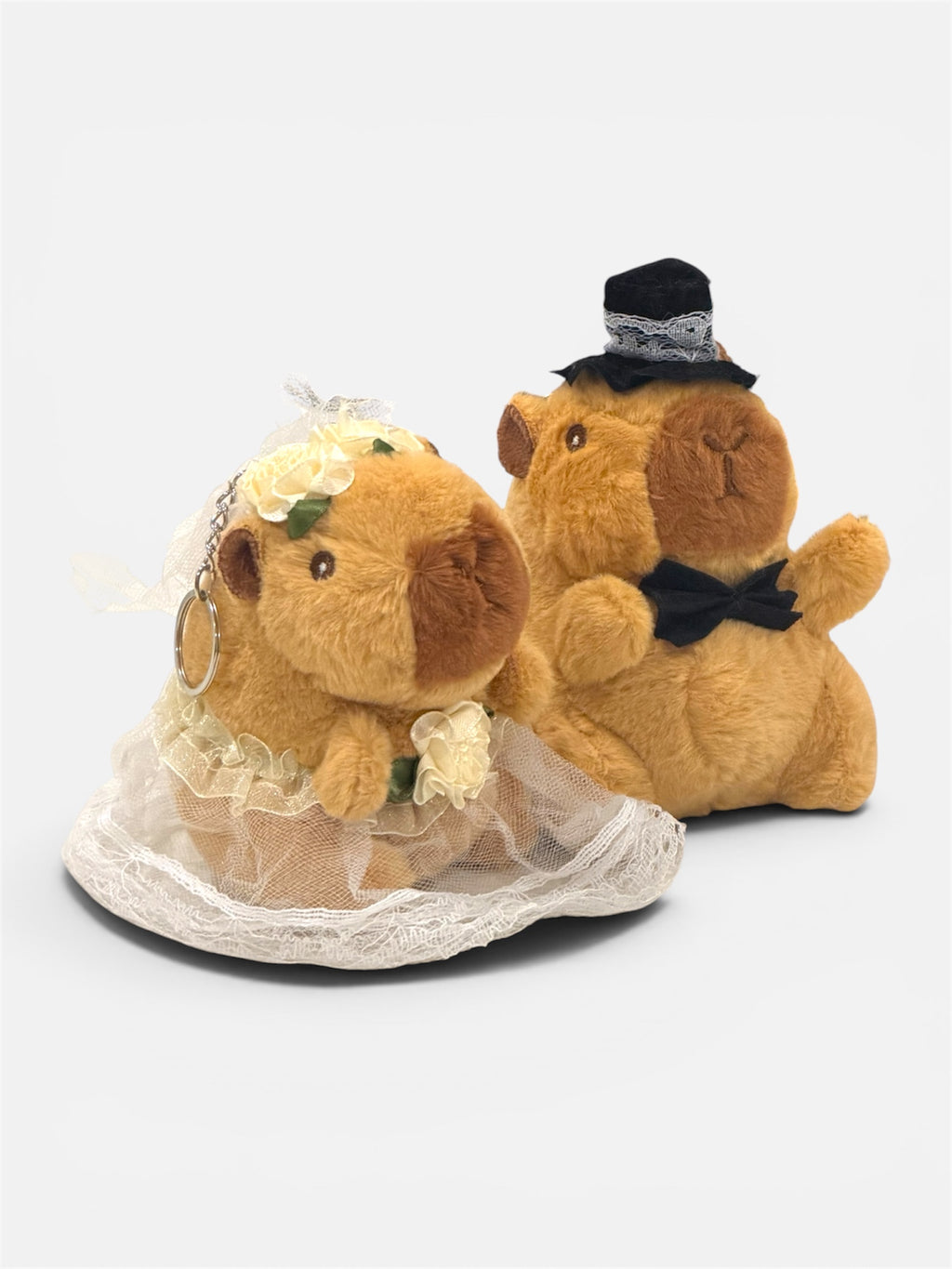 From our Capybara Plush Keychain range - our beautiful wedding couple. Choose from either the bride or groom (or both!). Super-soft and cute Capybara with wedding accessories to match. From Australia’s biggest Capybara toy store. Check out our range for the very latest Capy products, the best Capybara gifts and general Capy happiness. 